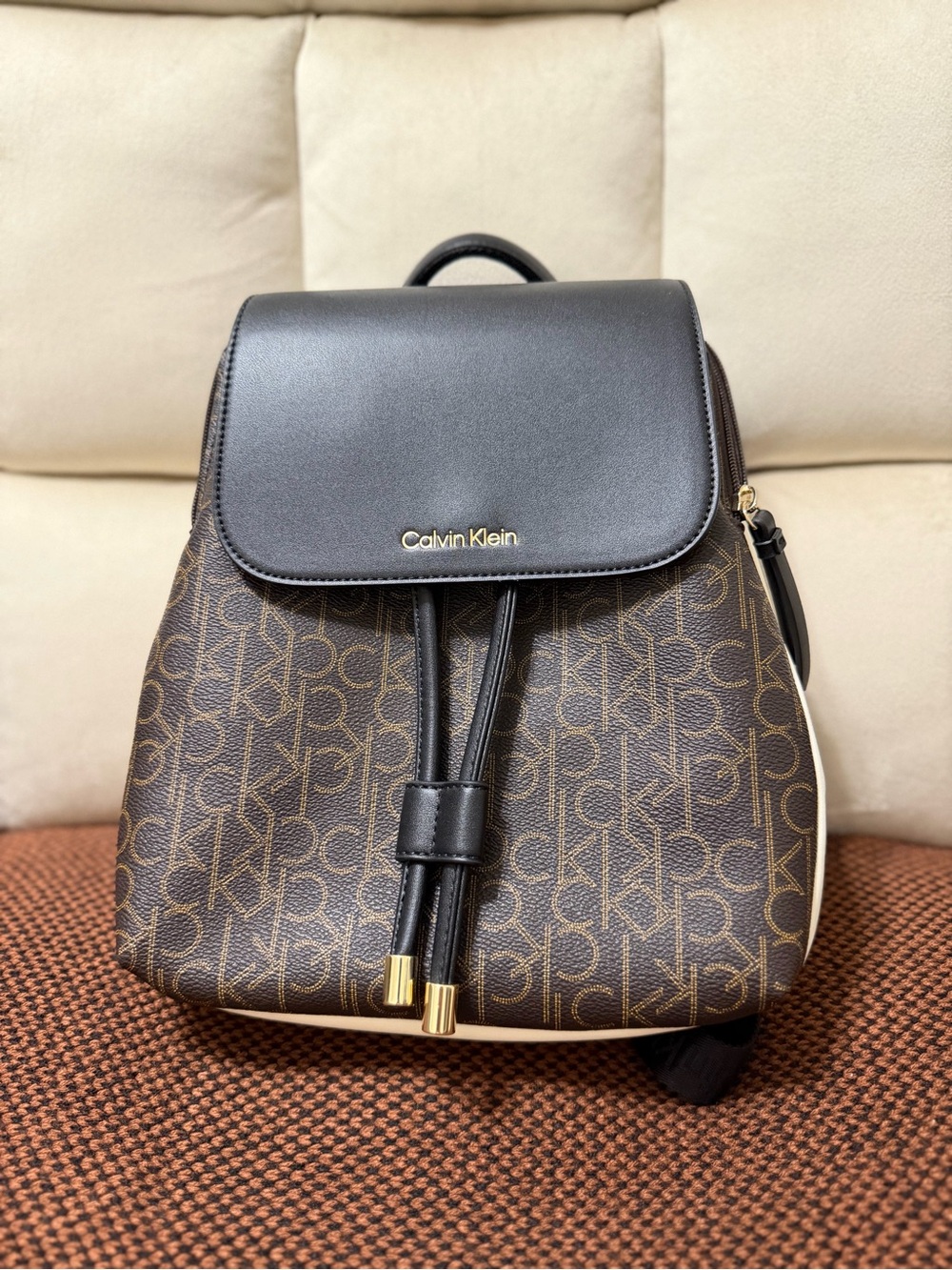 Calvin Klein Brown Monogram Drawstring Backpack with Black Flap